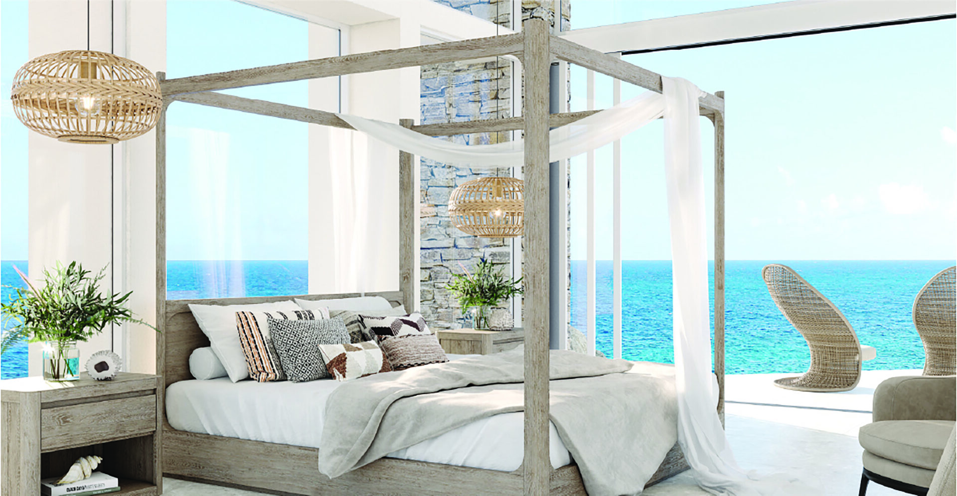 A bright, airy Boulder Homesite bedroom overlooking the ocean features a four-poster bed with draped white fabric and a mix of pillows. Two woven pendant lights hang above a side table with plants, and large windows display the sea and sky in the background.