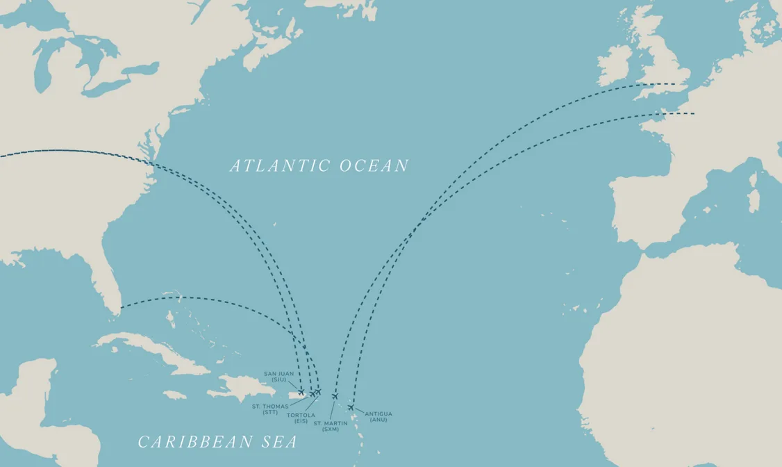A curated minimalist map of the Atlantic Ocean and Caribbean Sea, featuring clean lines and "white space". Arched dashed lines illustrate "accessible" travel routes from North America and Europe to regional hubs like San Juan, St. Thomas, and Tortola, leading finally to the "hidden gem" of Oil Nut Bay.