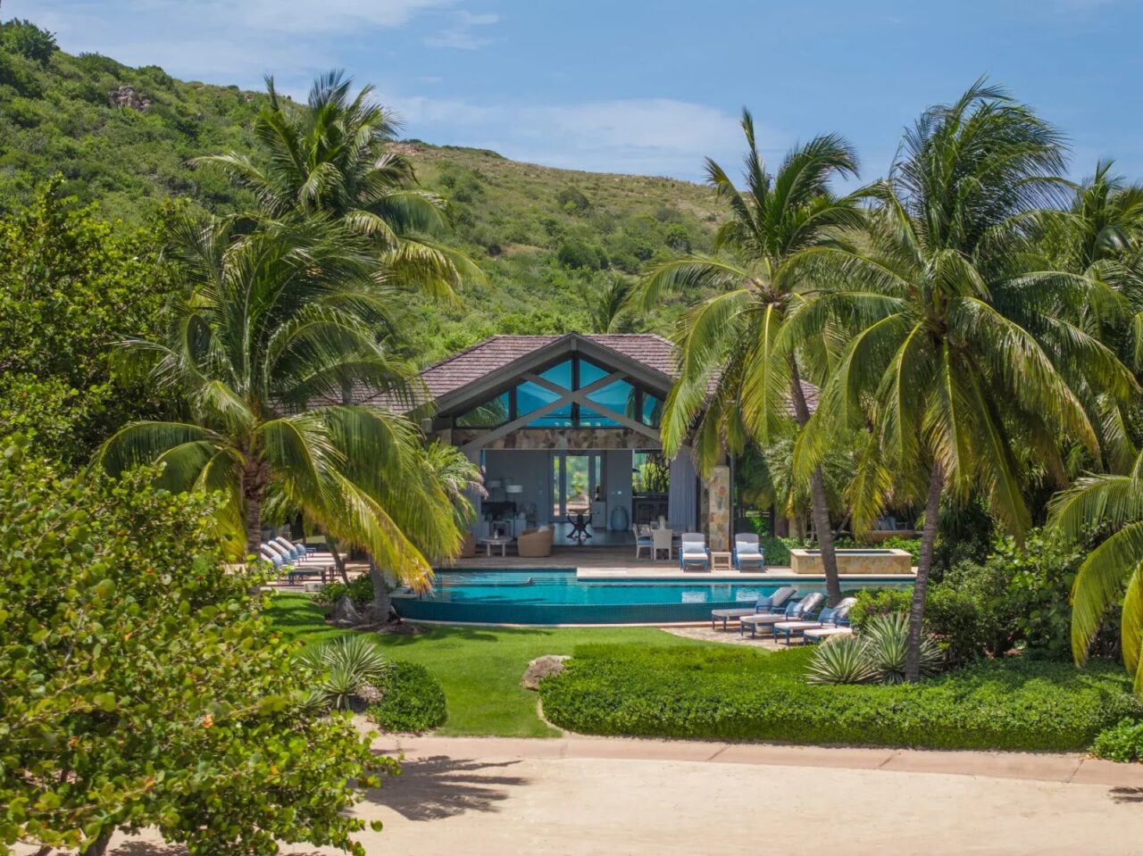 Luxury hillside villa pool overlooking turquoise Caribbean waters at Oil Nut Bay, Virgin Gorda.