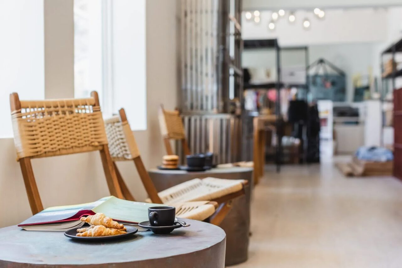 Fresh croissants and coffee served on a cozy seating table inside the Coffee Shop at Oil Nut Bay.