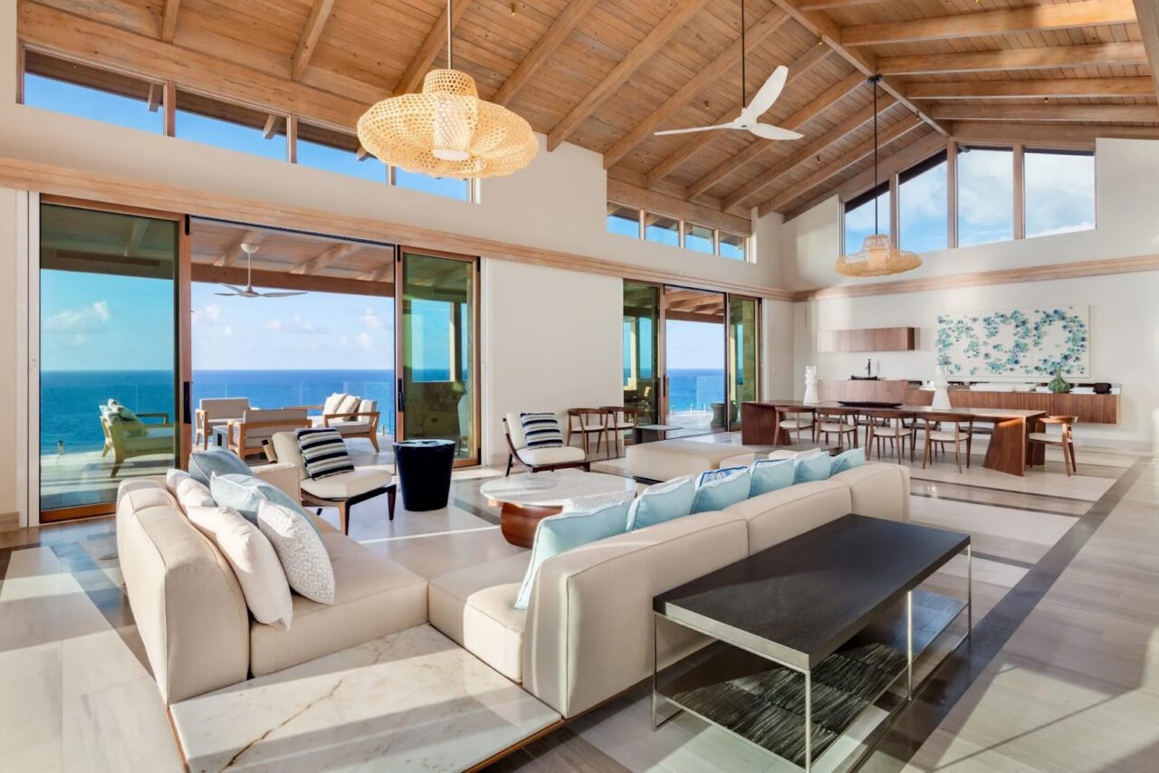 Open-concept Great Room at Villa Maronti with soaring timber ceilings and sweeping ocean vistas. 