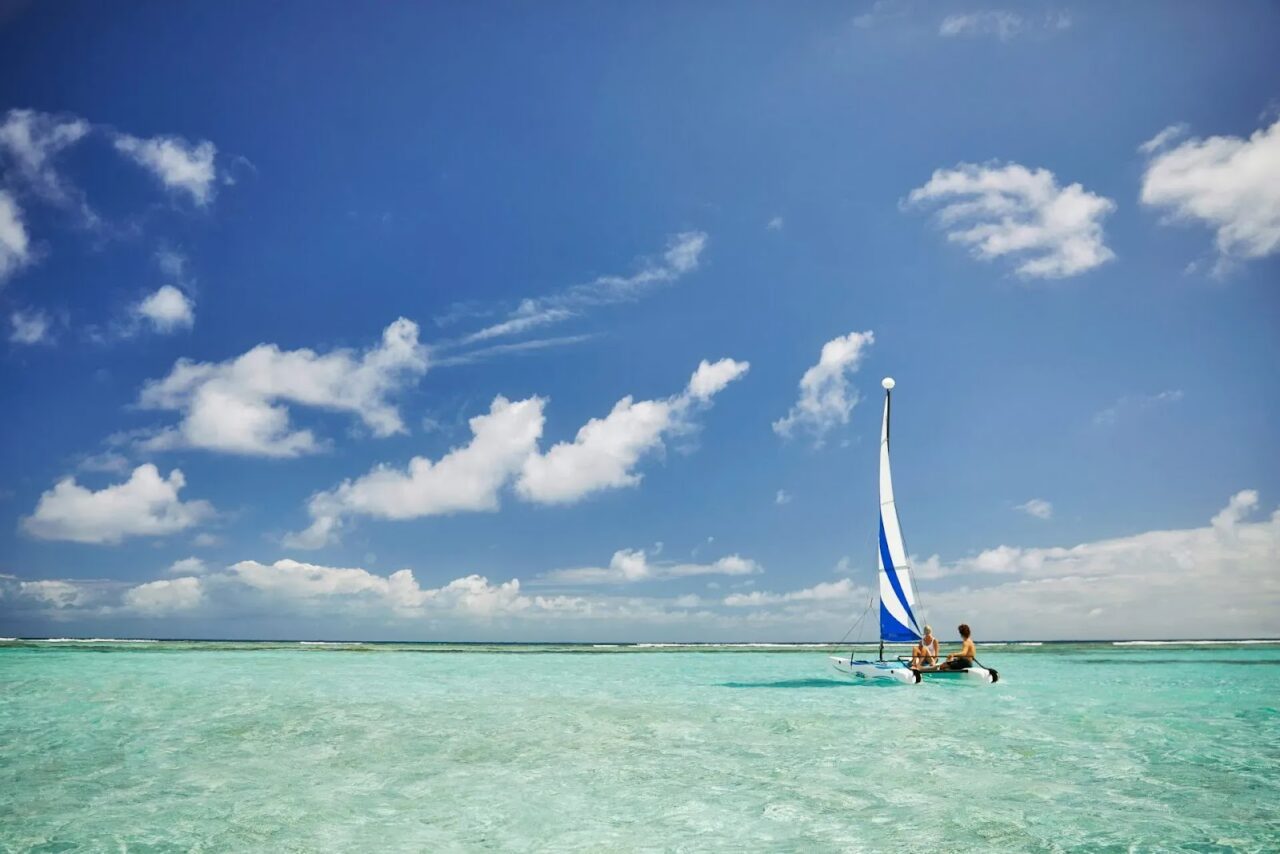 Hobie Cat sailing across calm, crystal-clear turquoise waters in the BVI
